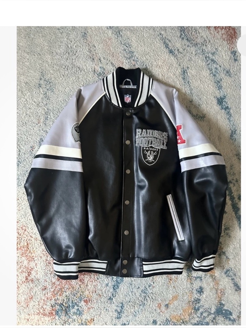 G-III Sports by Carl Banks.
Black and Gray Raiders Varsity Jacket